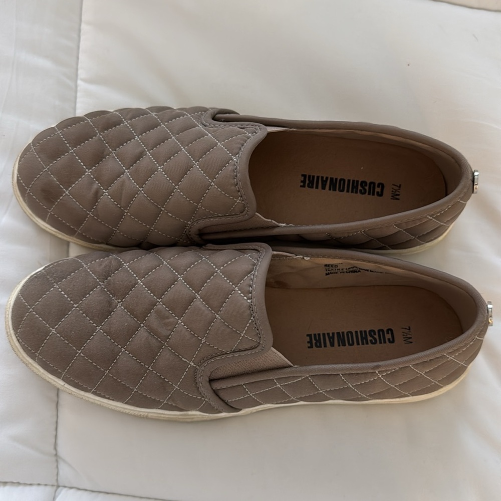 Tan flat shoes, with white bottom lightly worn